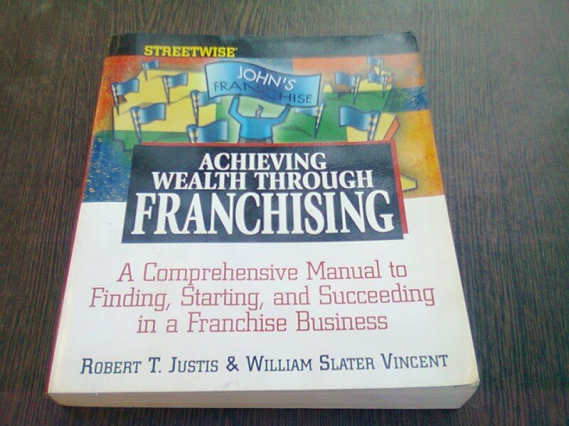 ACHIEVING WEALTH THROUGH FRANCHISING - ROBERT T. JUSTIS  (CARTE IN LIMBA ENGLEZA)