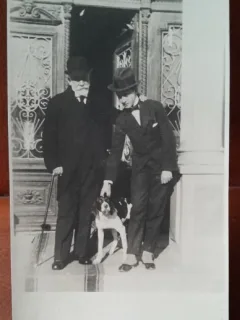 Fotografie tip carte postala, barbati impreuna cu cainele, perioada interbelica