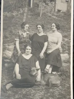 Fotografie tip Carte Postala, Patru femei si un caine, in curtea casei, perioada interbelica