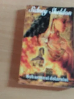 SUB SEMNUL DOLARULUI-SIDNEY SHELDON