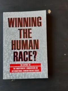 WINNING THE HUMAN RACE? - SADRUDDIN AGA KHAN  (CARTE IN LIMBA ENGLEZA)