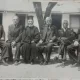 Fotografie, Grup de barbati, in mijloc un preot, perioada interbelica