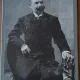 Fotografie pe carton, barbat cu mustata si cioc, inceput de secol XX