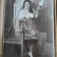 Fotografie pe carton, Tanara in costum popular, cu fuior, perioada interbelica