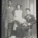 Fotografie tip Carte Postala, Doi barbati si o femeie, cu flori, perioada interbelica