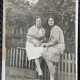 Fotografie tip Carte Postala, Romania, doua femei stand pe un gardulet, la tara, 1929