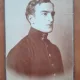Fotografie pe carton, tanar cu tunica militara, perioada interbelica