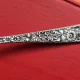 Lingură din argint (sterling silver) cu motive florale și fructe în relief